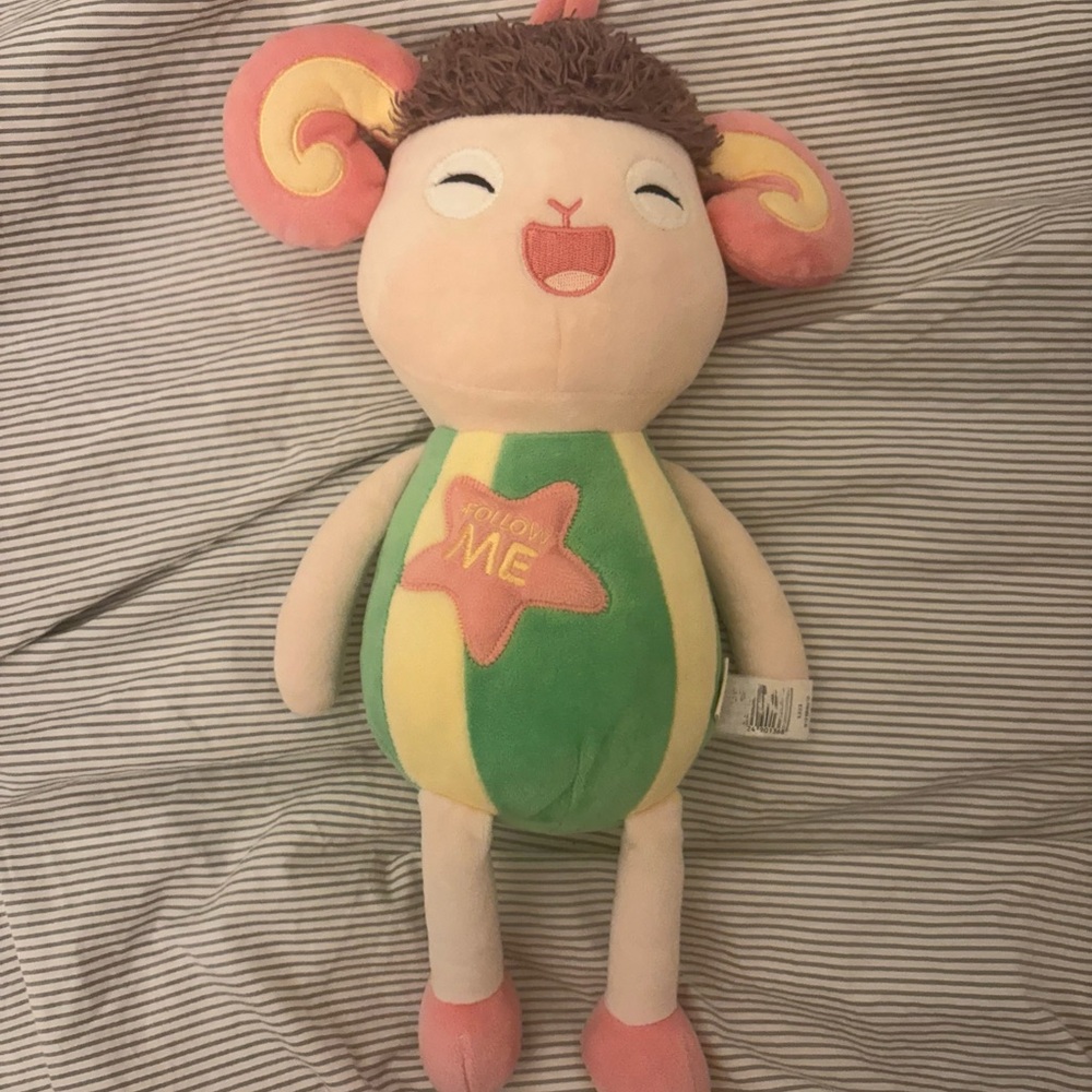 Colorful Plush Toy with Pink and Green Accents